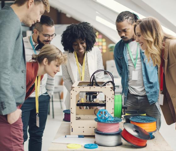 Decorative image - People looking at 3D printer